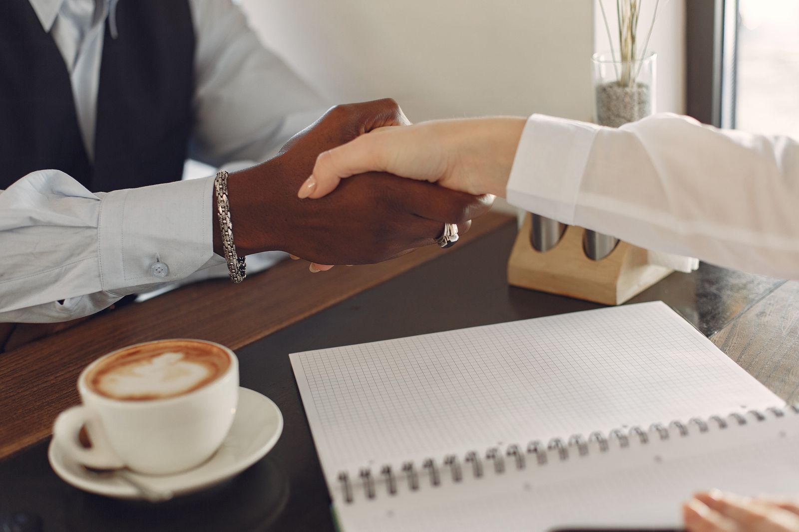 Two advisors reviewing financial documents at a desk